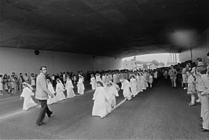 a manipulated print as they go to their first communion